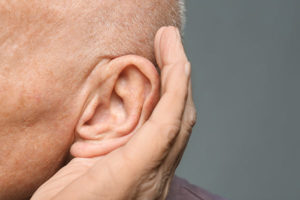 elderly man listening intently
